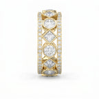 Side profile of luxury yellow gold diamond eternity ring showing open gallery and geometric settings