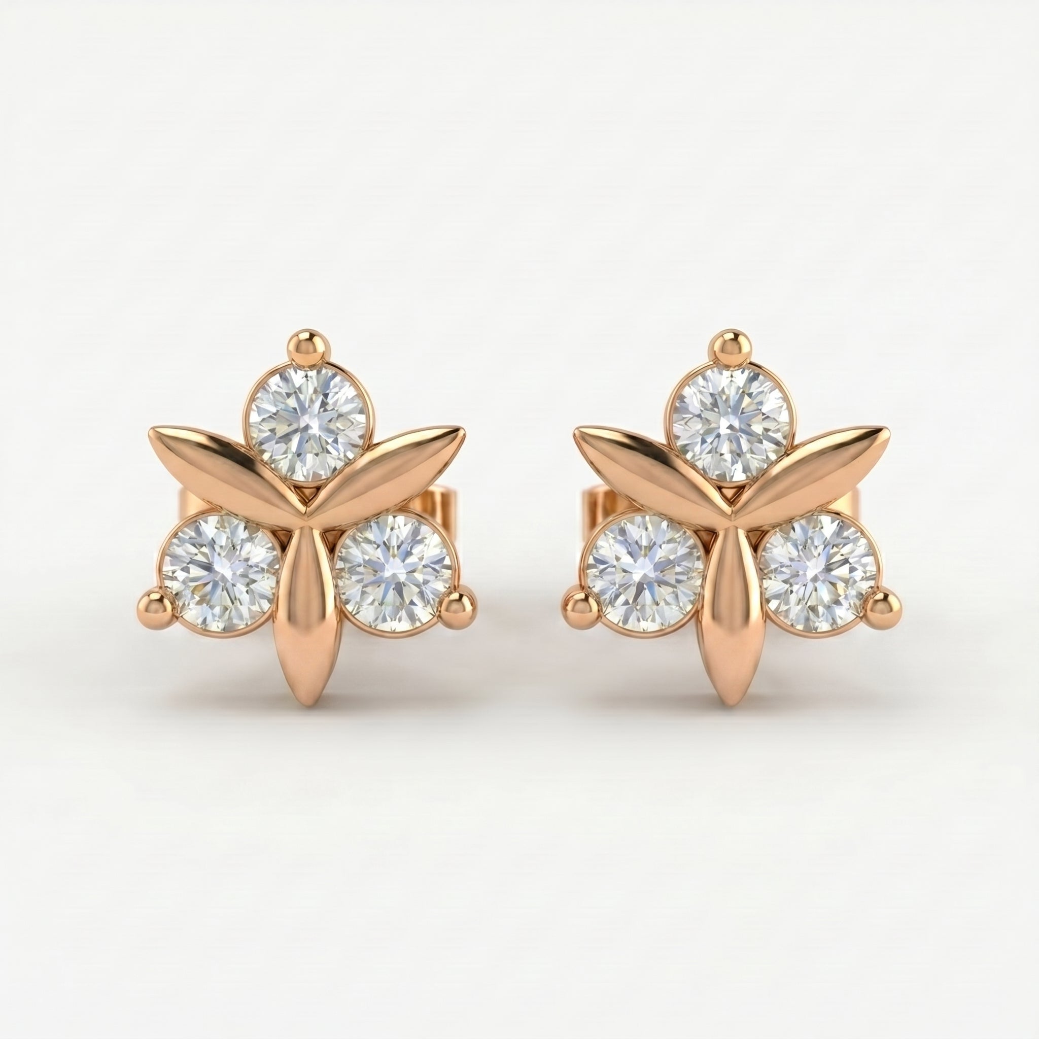 Rose gold floral stud earrings with round brilliant stones on white background, minimalist luxury jewelry design