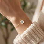 Close-up of asscher cut solitaire bracelet showing fine gold prongs and premium chain craftsmanship