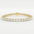 Asscher cut tennis bracelet in polished yellow gold featuring brilliant square stones on a luxury white background.