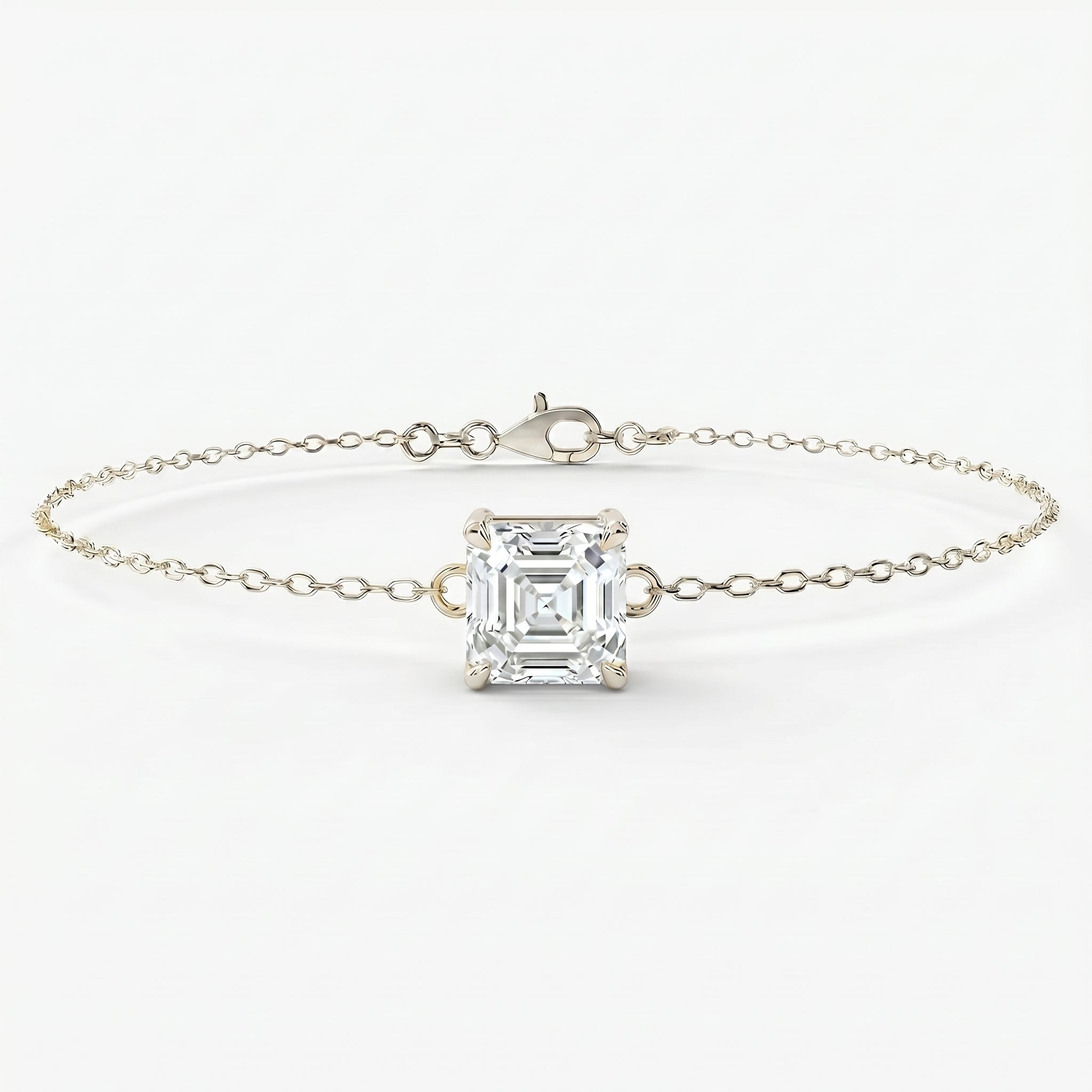 Elegant asscher cut diamond bracelet in fine gold chain shown at luxury angled studio perspective