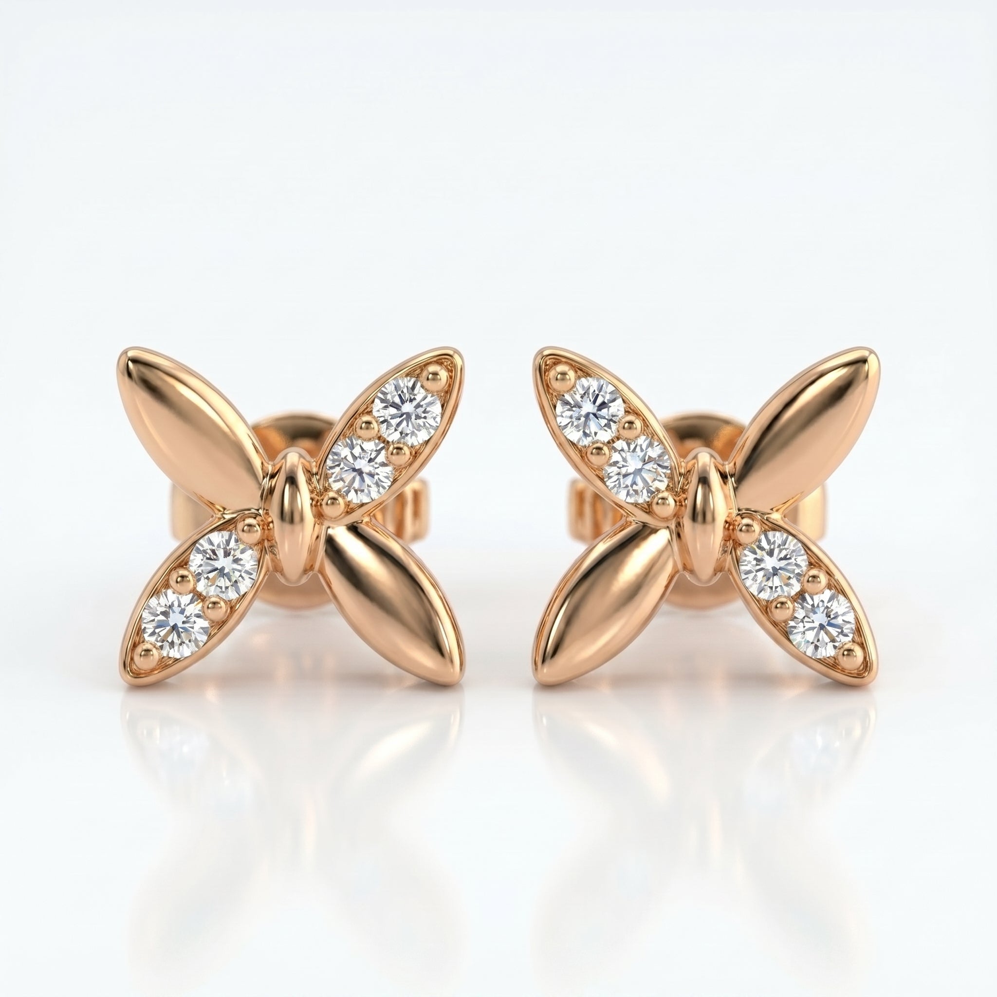 Luxury butterfly diamond stud earrings at 45-degree angle showing polished gold finish and sparkling stones