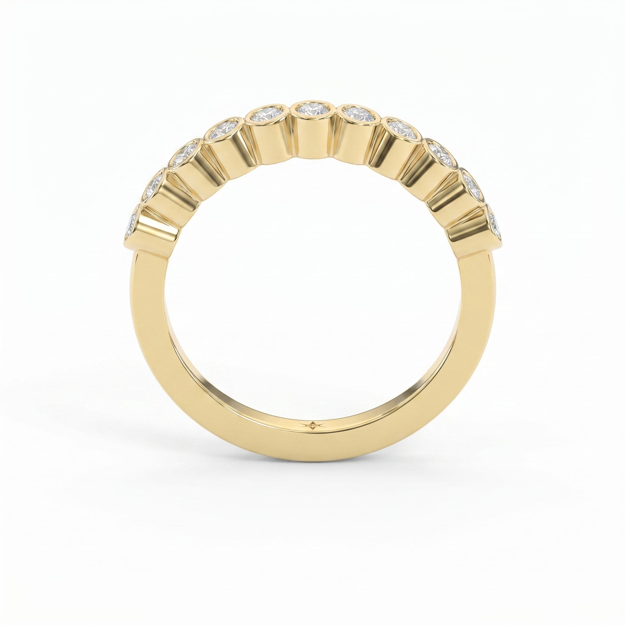 Curved yellow gold diamond wedding band with bezel-set round diamonds, minimalist luxury stacking ring design