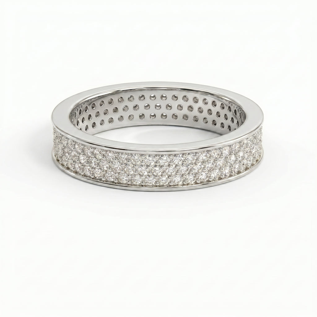 Side profile of diamond eternity ring showing pavé setting craftsmanship and polished precious metal band.
