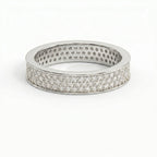 Side profile of diamond eternity ring showing pavé setting craftsmanship and polished precious metal band.