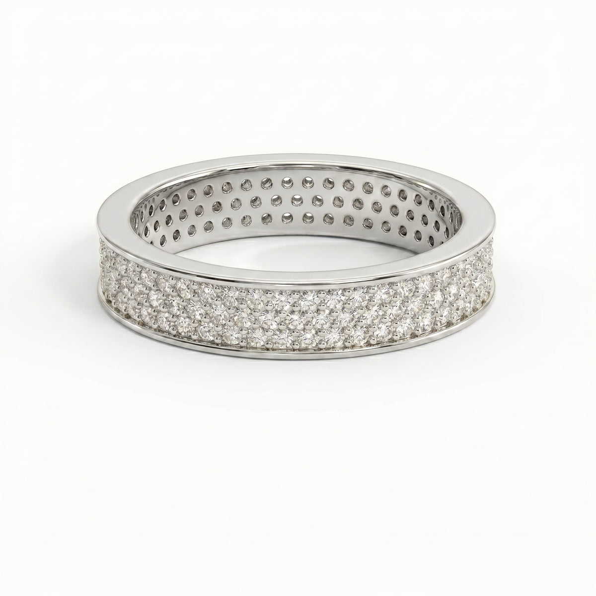 Side profile of diamond eternity ring showing pavé setting craftsmanship and polished precious metal band.