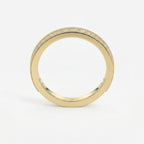Diamond eternity band in yellow gold featuring round brilliant diamonds and milgrain detailing on a white background.