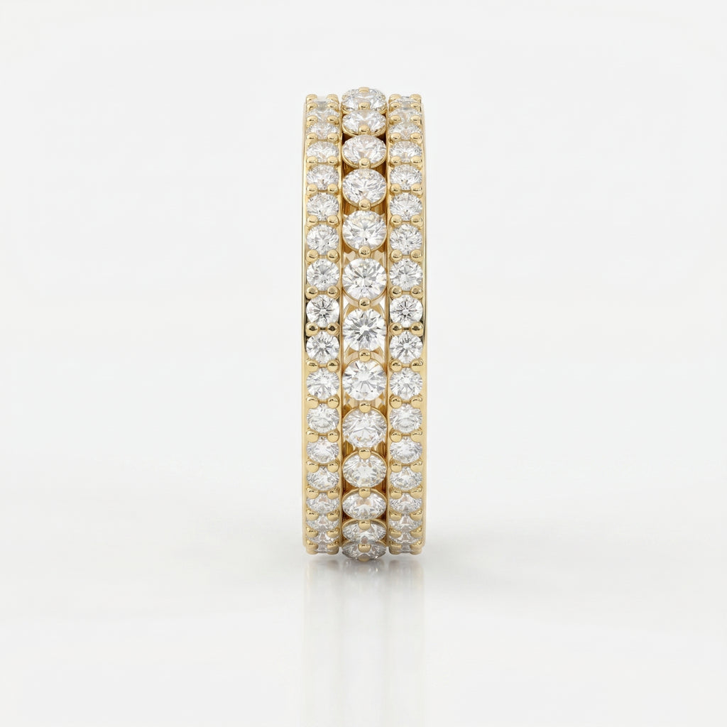 Side view of yellow gold diamond eternity band showing open gallery design and secure diamond setting