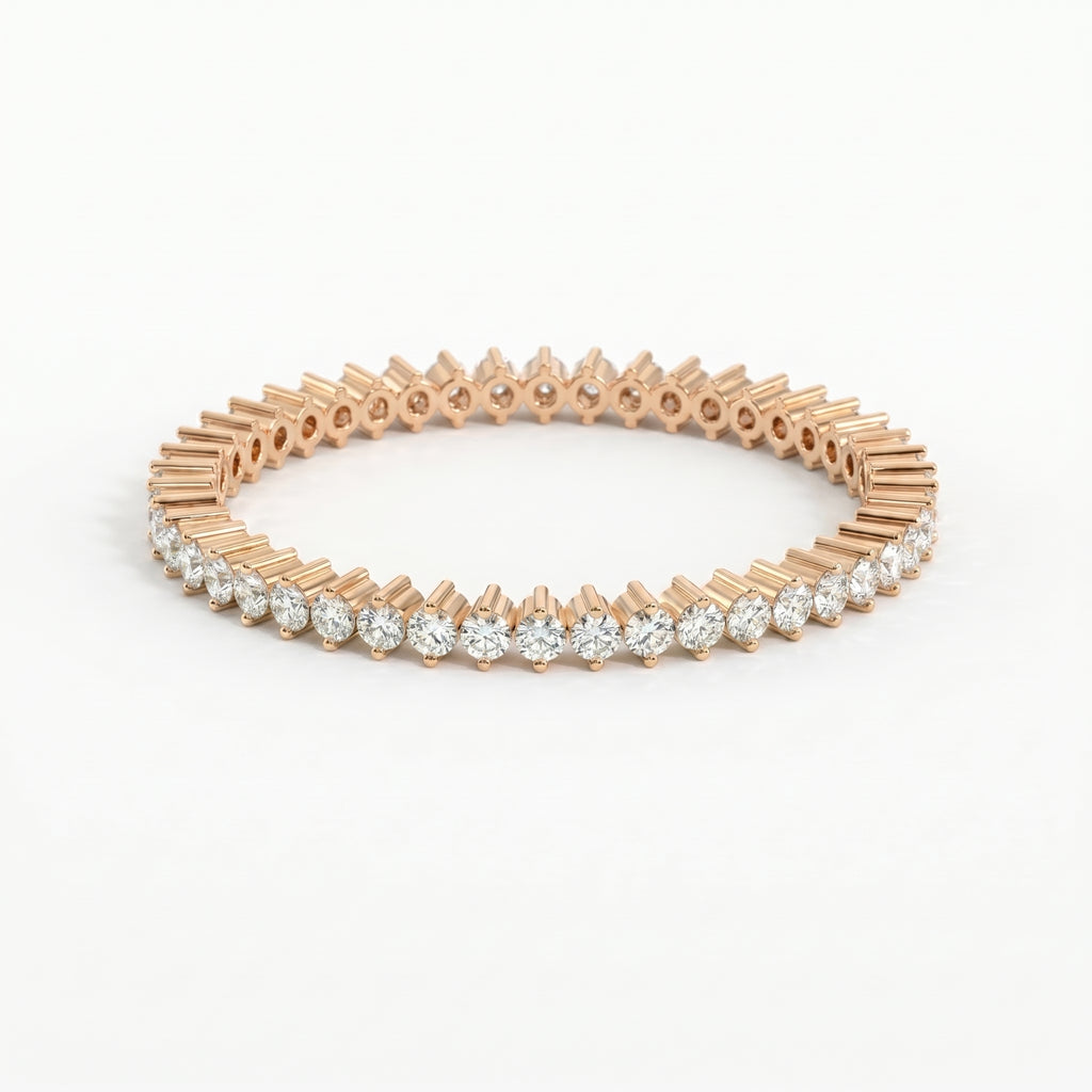 Rose gold bracelet with clear gemstones on a white background