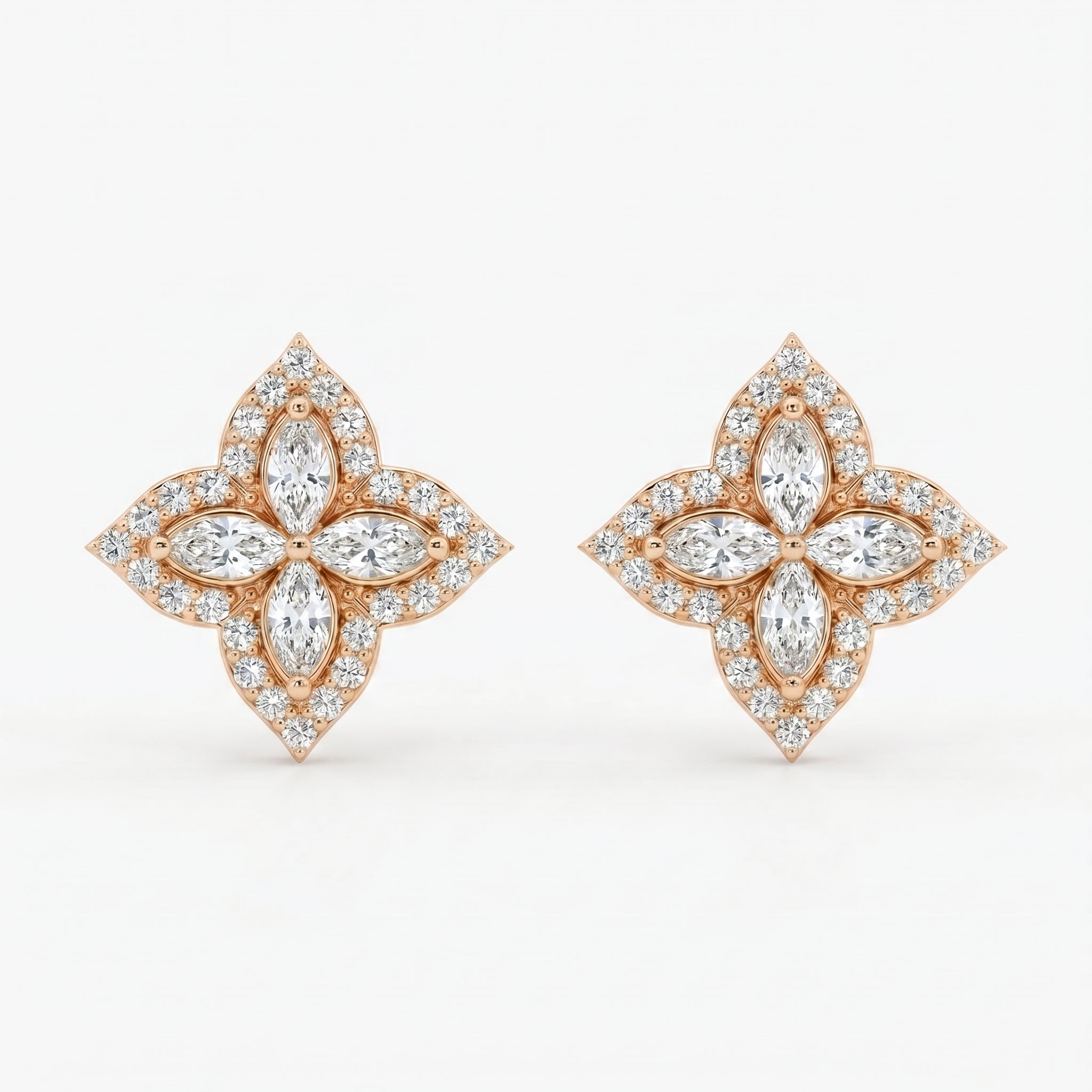 Macro close-up of floral diamond earrings showing marquise stones pavé detailing and polished gold