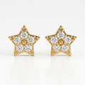 Macro close-up of pavé diamond star earrings showing sparkling stones and intricate gold bead detailing