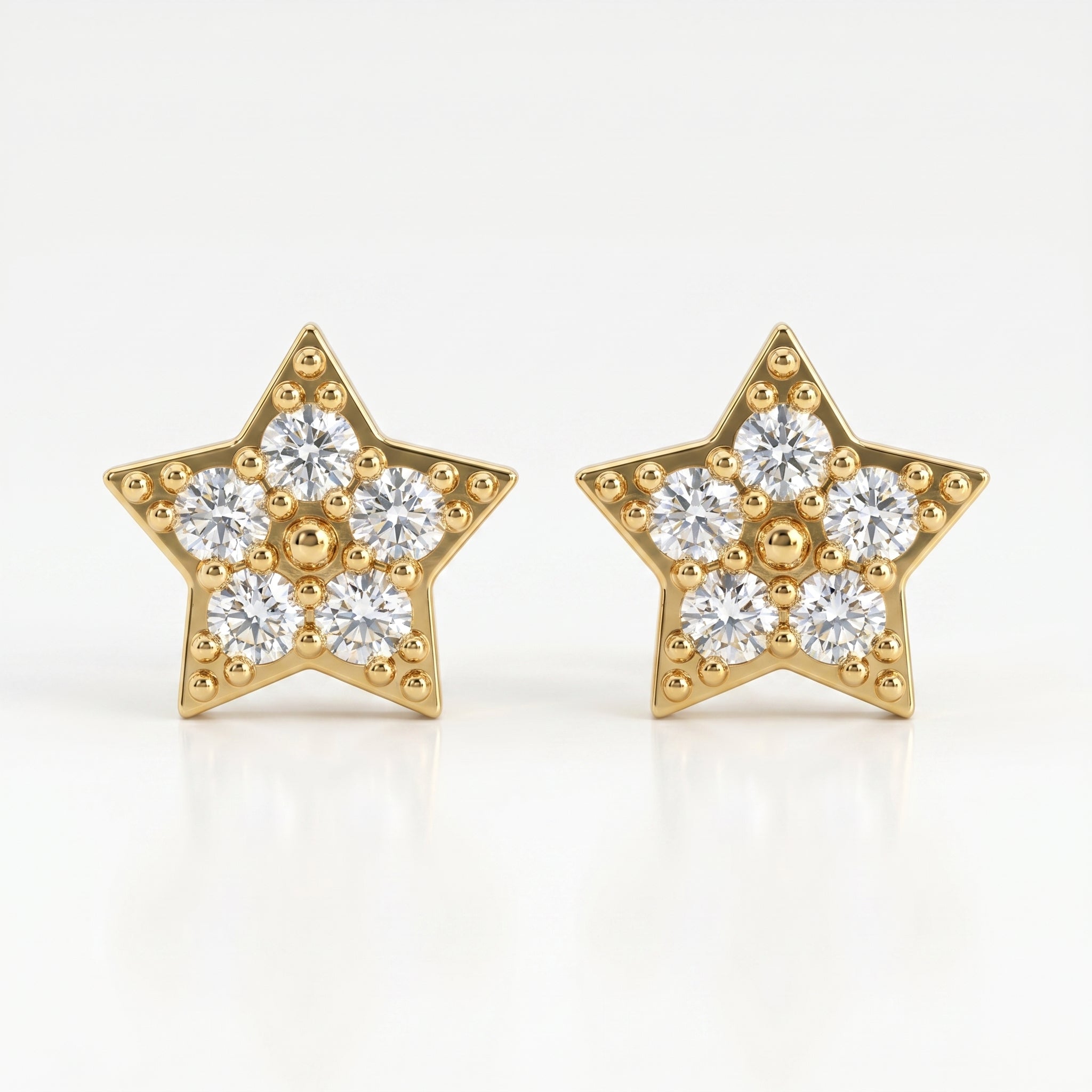 Macro close-up of pavé diamond star earrings showing sparkling stones and intricate gold bead detailing