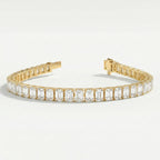 Side profile of emerald cut diamond tennis bracelet displaying yellow gold prong setting and craftsmanship.