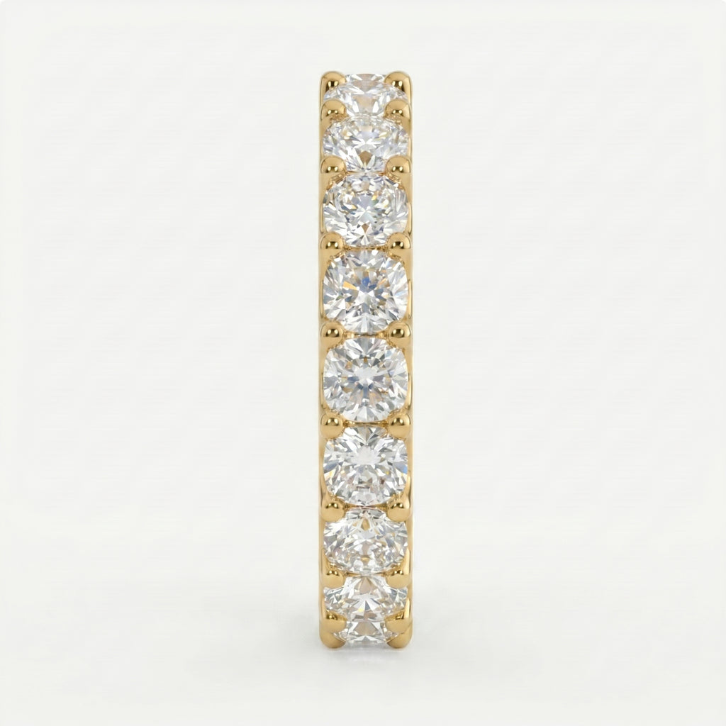 Gold earring with clear gemstones on a light gray background