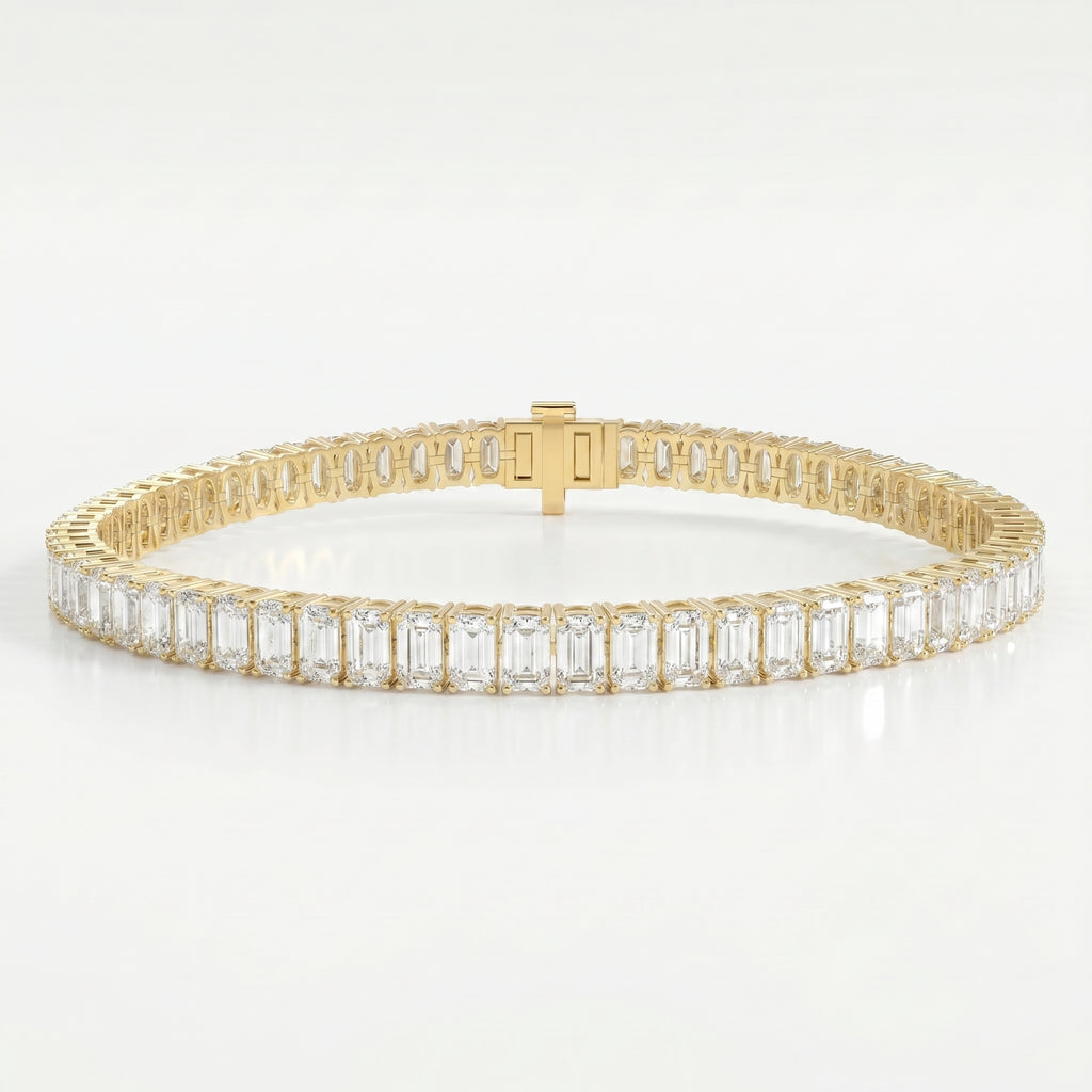 Emerald cut diamond tennis bracelet in yellow gold with secure box clasp and brilliant sparkle on white background.