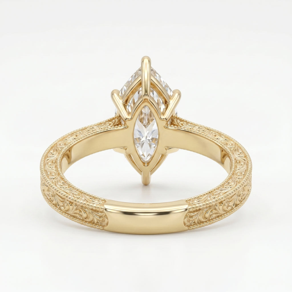 Close-up of vintage engraved yellow gold band with intricate milgrain craftsmanship and fine detailing