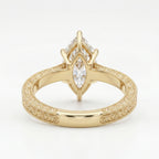 Close-up of vintage engraved yellow gold band with intricate milgrain craftsmanship and fine detailing