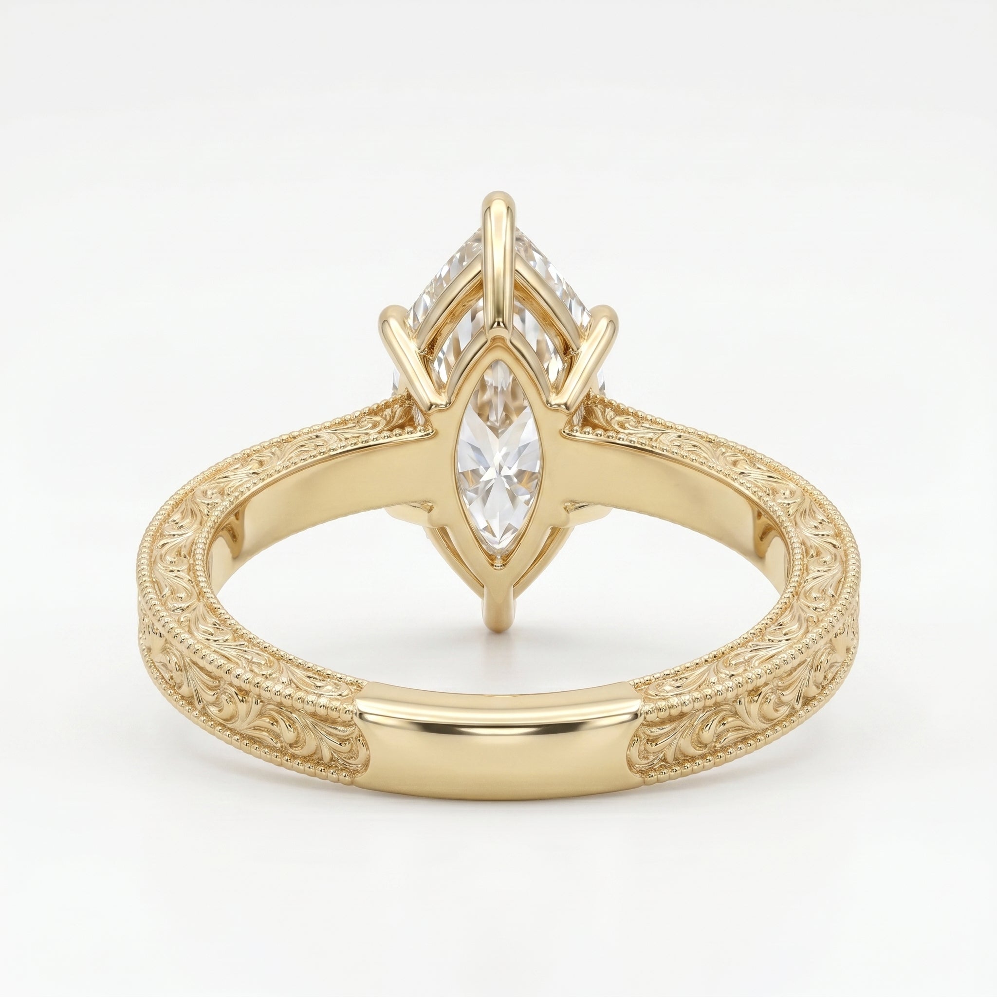 Close-up of vintage engraved yellow gold band with intricate milgrain craftsmanship and fine detailing