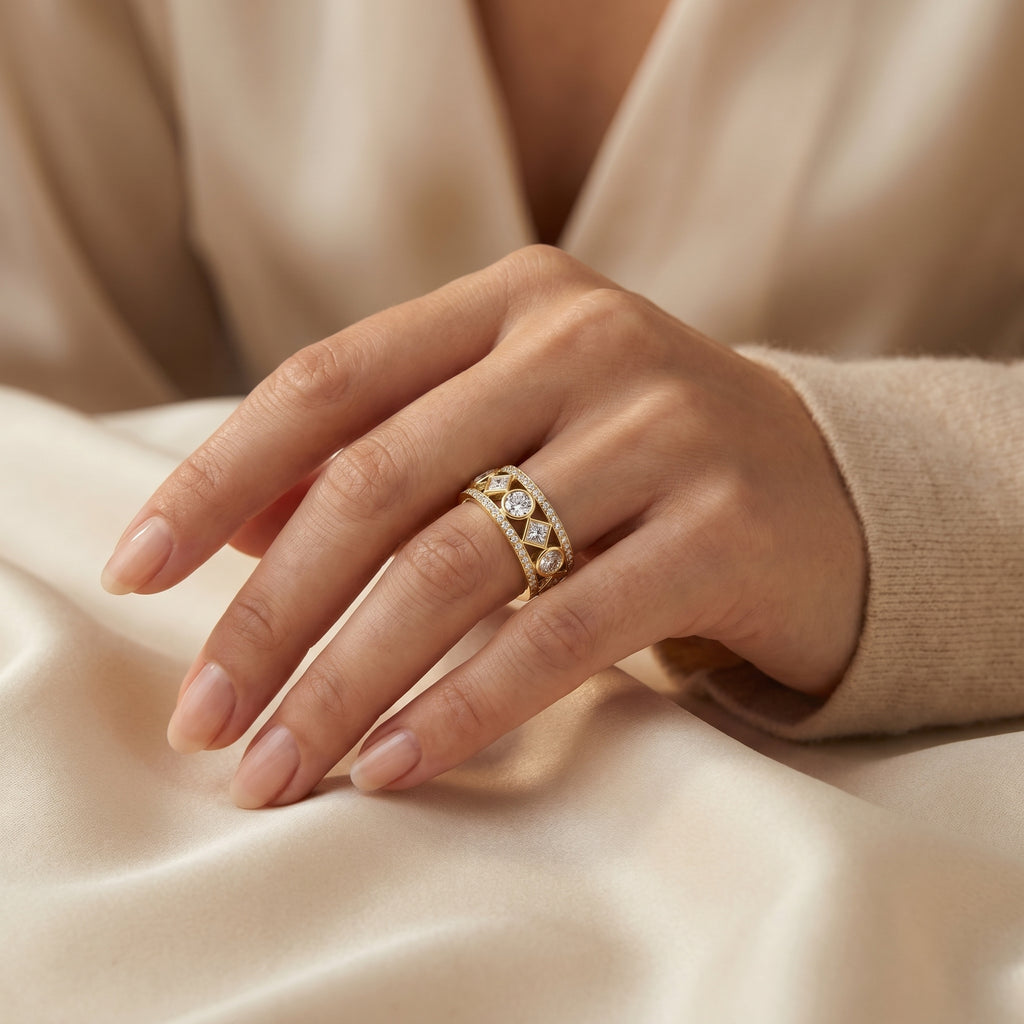 Geometric diamond band ring in yellow gold featuring round and princess cut diamonds with pavé accents