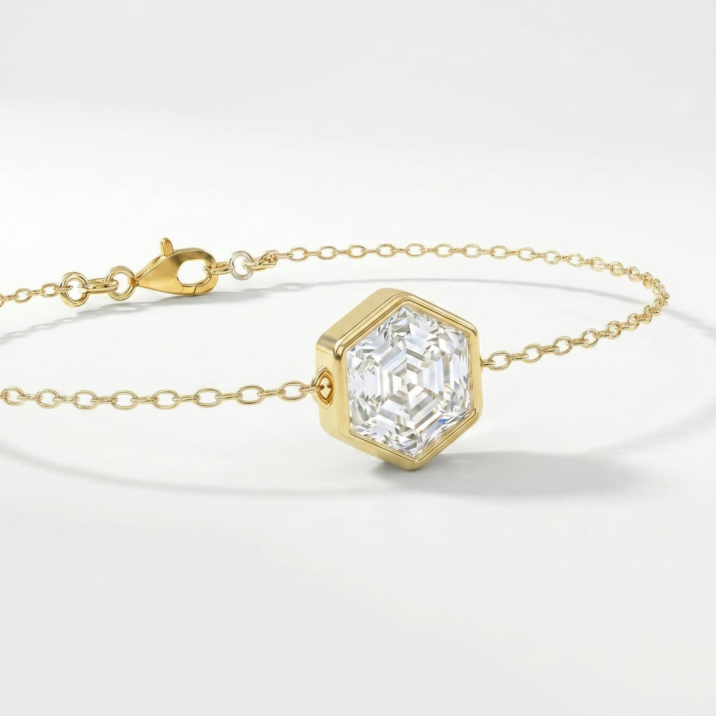 Elegant geometric gold bracelet with hexagon-cut clear stone and fine luxury chain detail