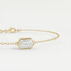 Luxury gold bracelet featuring hexagon-cut diamond style gemstone with delicate chain detail