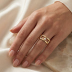 Modern yellow gold open band ring with Baguette-cut stones, minimalist geometric fine jewelry design