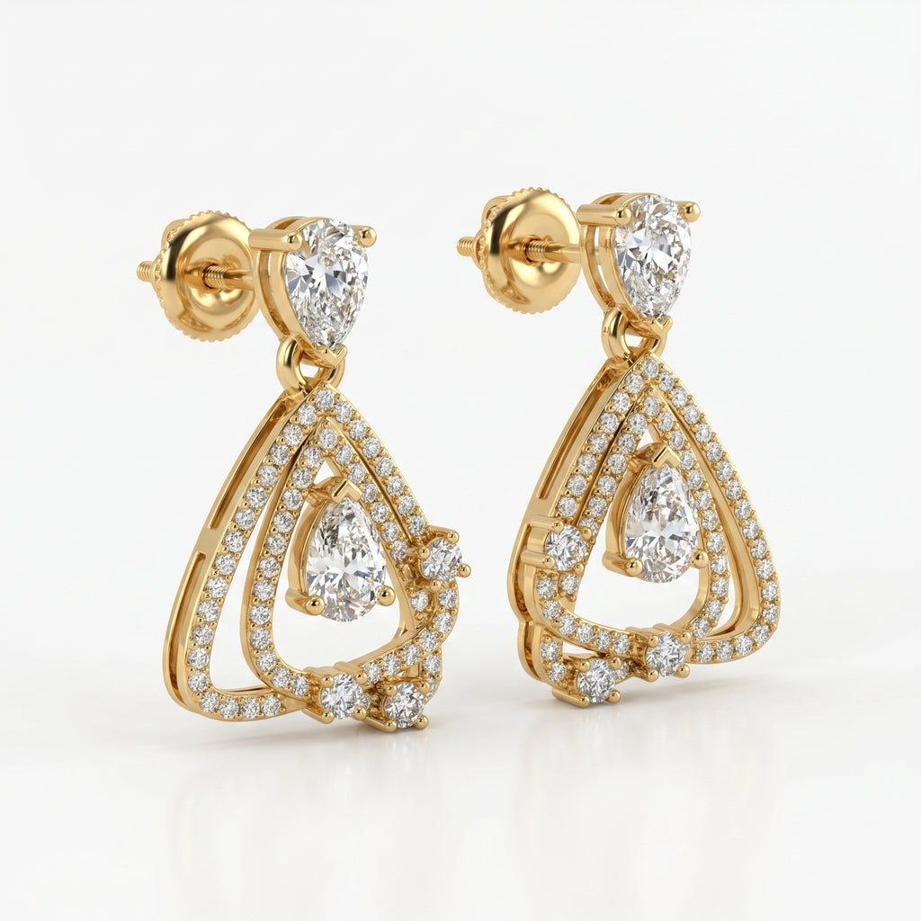 Yellow gold geometric drop earrings with pear-cut diamonds shown from a 45-degree angle highlighting craftsmanship