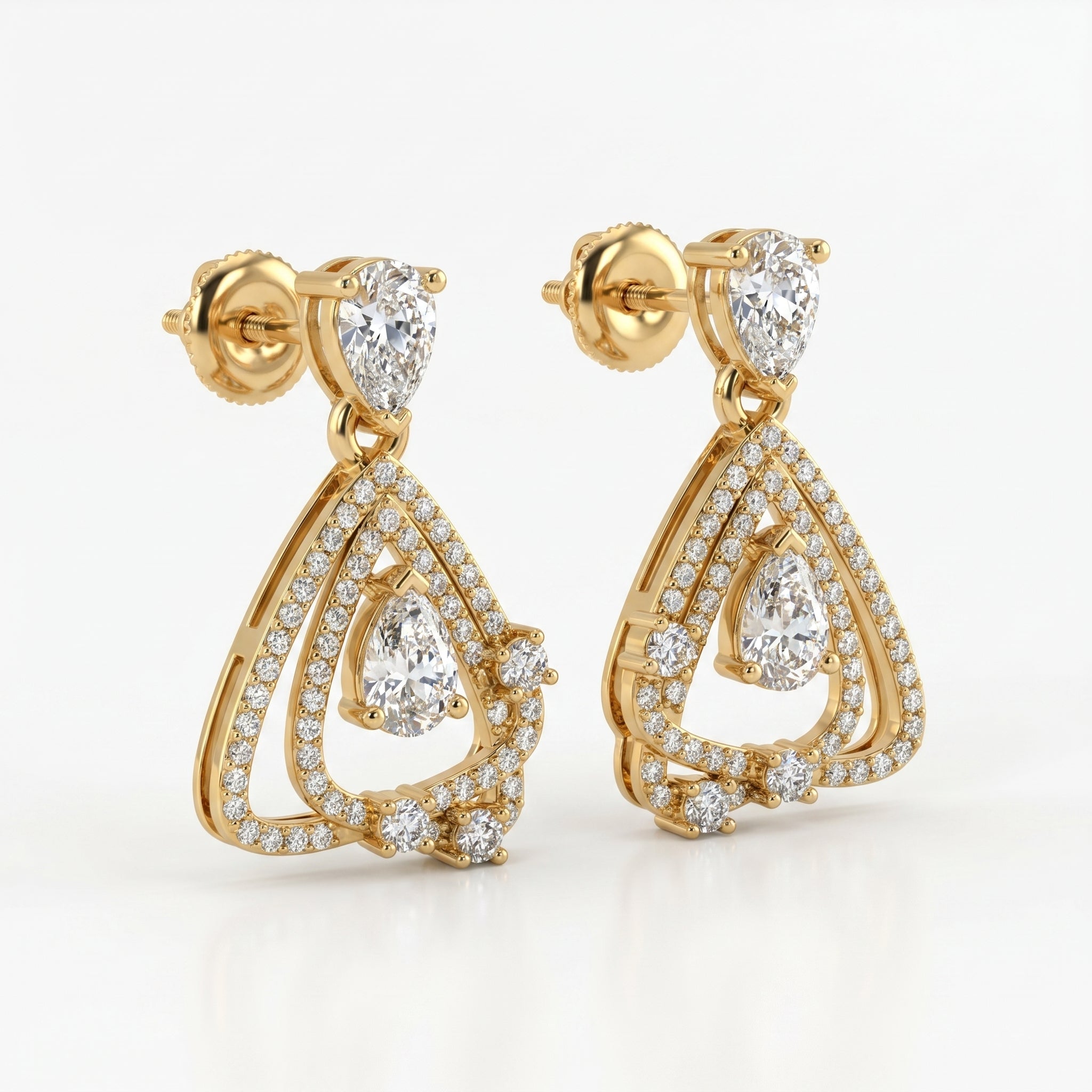 Yellow gold geometric drop earrings with pear-cut diamonds shown from a 45-degree angle highlighting craftsmanship