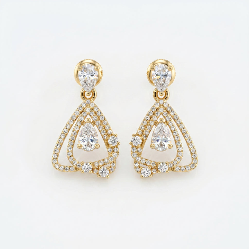 Luxury yellow gold pear drop diamond earrings with pavé detailing and geometric open-frame design on white background
