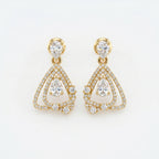 Luxury yellow gold pear drop diamond earrings with pavé detailing and geometric open-frame design on white background