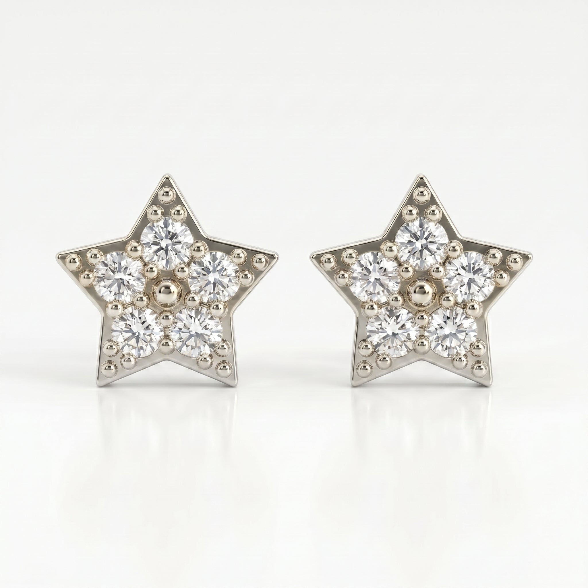 45-degree view of gold star pavé stud earrings with sparkling stones and polished luxury metal finish