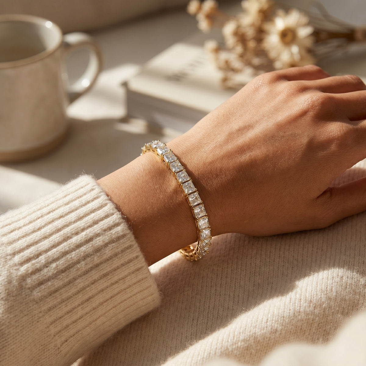 Close up of secure clasp and link construction on premium gold tennis bracelet with princess cut stones