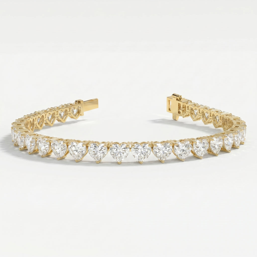 Top view of yellow gold heart diamond tennis bracelet featuring continuous heart-cut stones and luxury finish