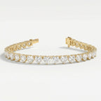 Top view of yellow gold heart diamond tennis bracelet featuring continuous heart-cut stones and luxury finish