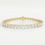 Luxury yellow gold heart diamond tennis bracelet with brilliant heart-cut stones and secure clasp on white background