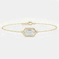 Minimalist gold chain bracelet with hexagon-cut clear gemstone in bezel setting on white background