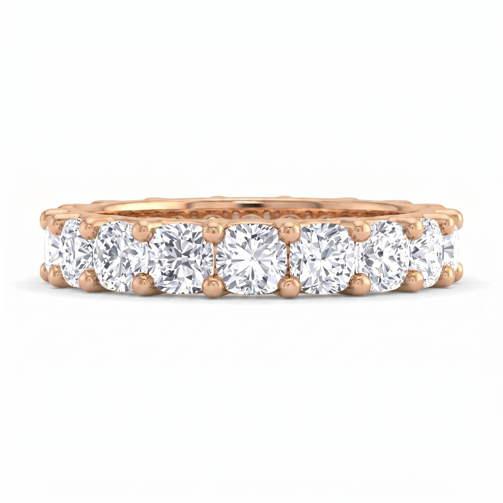 Rose gold ring with diamond stones on a white background