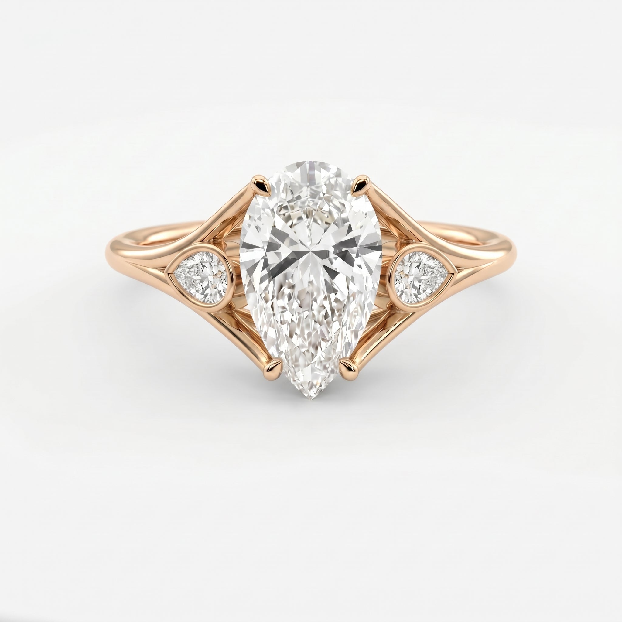 Custom 4‑Prong Diamond Ring with Bezel‑Set Pear Side Stones