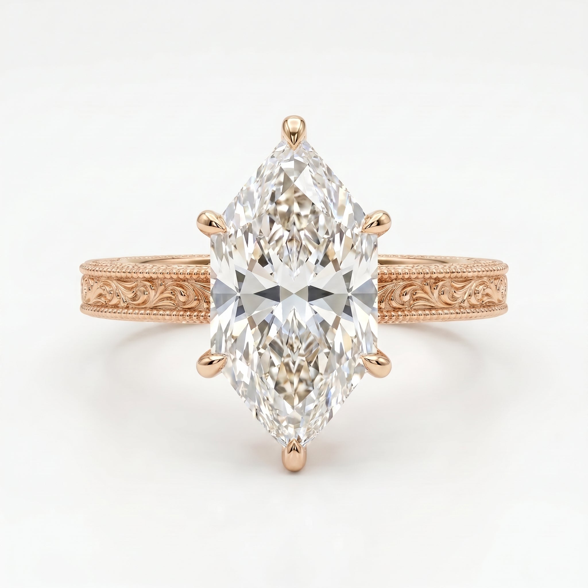 Rose gold marquise diamond engagement ring featuring an engraved vintage-inspired band and brilliant solitaire stone.