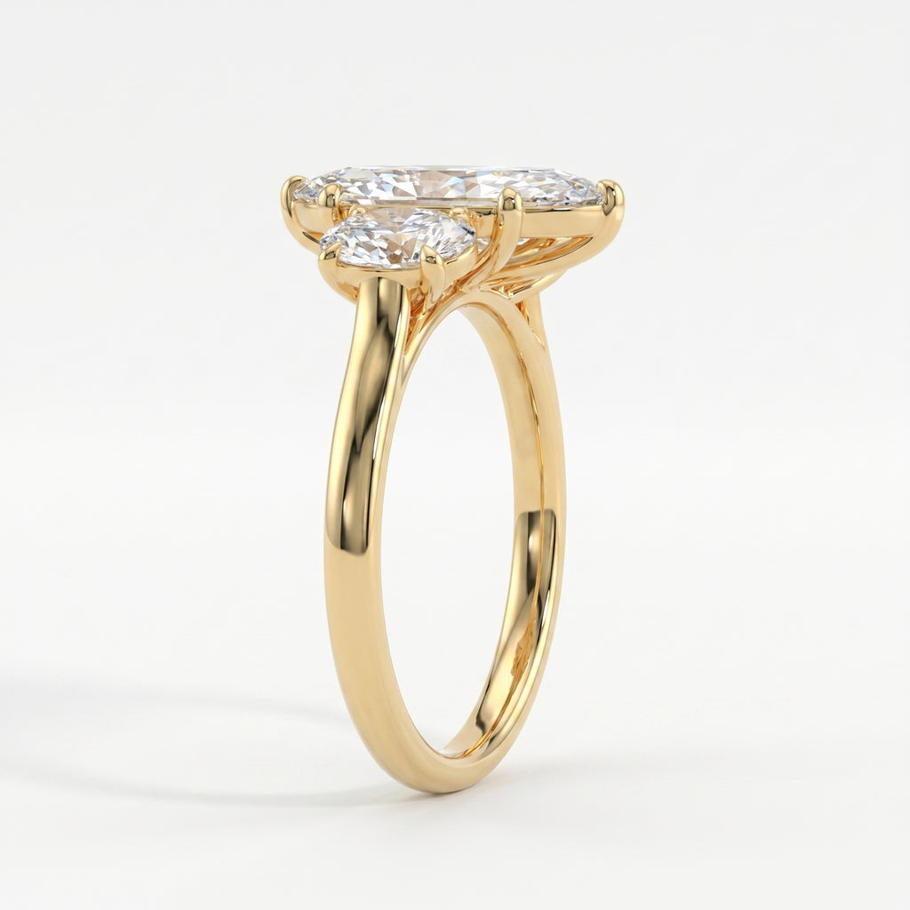 Side profile of marquise diamond engagement ring showing oval side stones and yellow gold setting