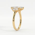 Side profile of marquise diamond engagement ring showing oval side stones and yellow gold setting
