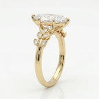 Luxury marquise cut diamond engagement ring with yellow gold botanical band shown at a 45 degree angle