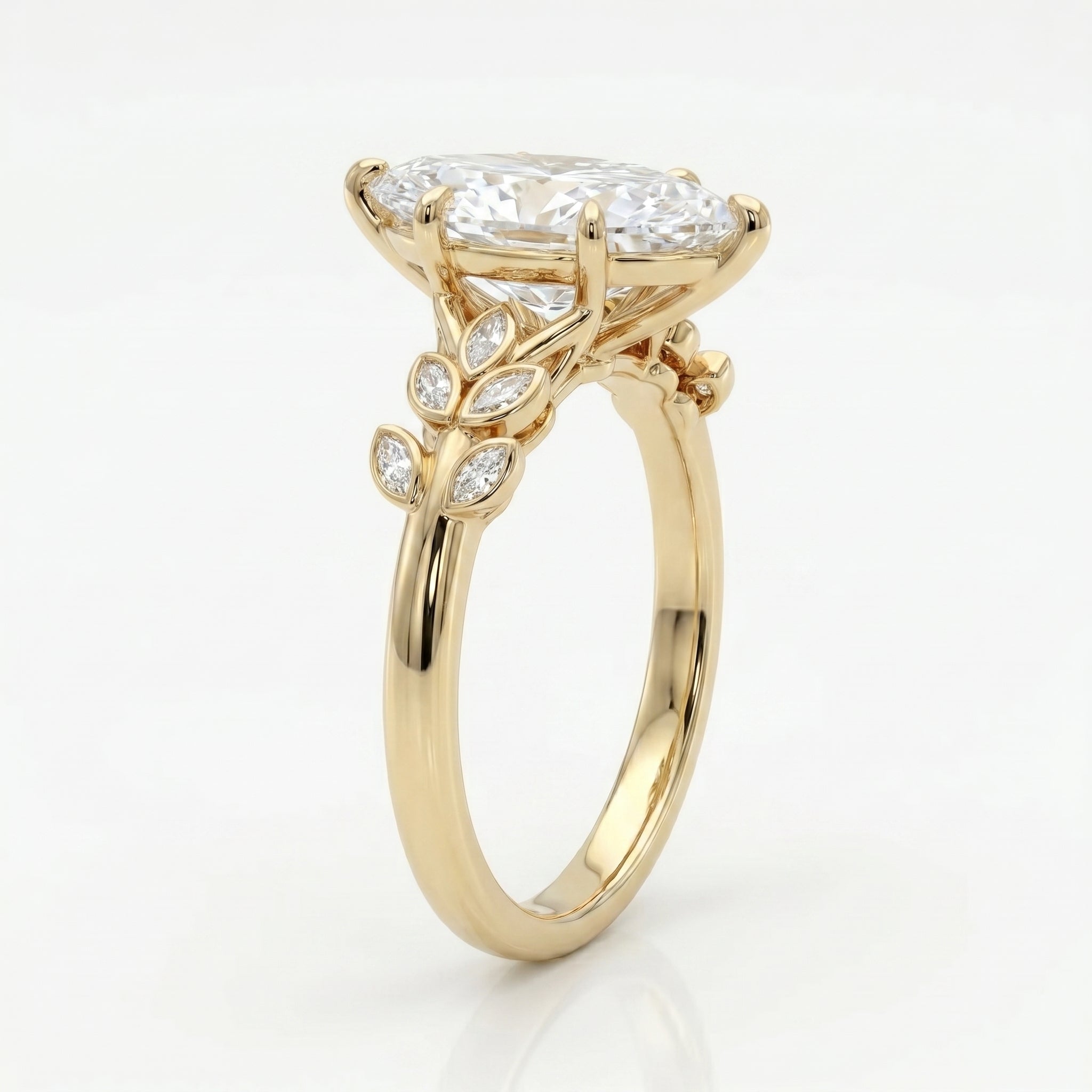 Luxury marquise cut diamond engagement ring with yellow gold botanical band shown at a 45 degree angle