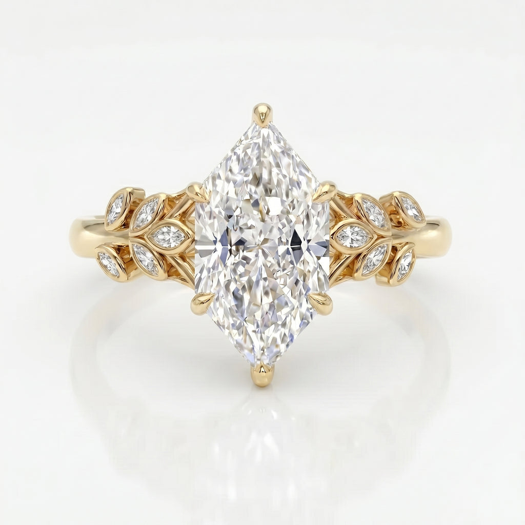 Marquise diamond engagement ring in yellow gold with leaf-inspired diamond accents on a clean white background