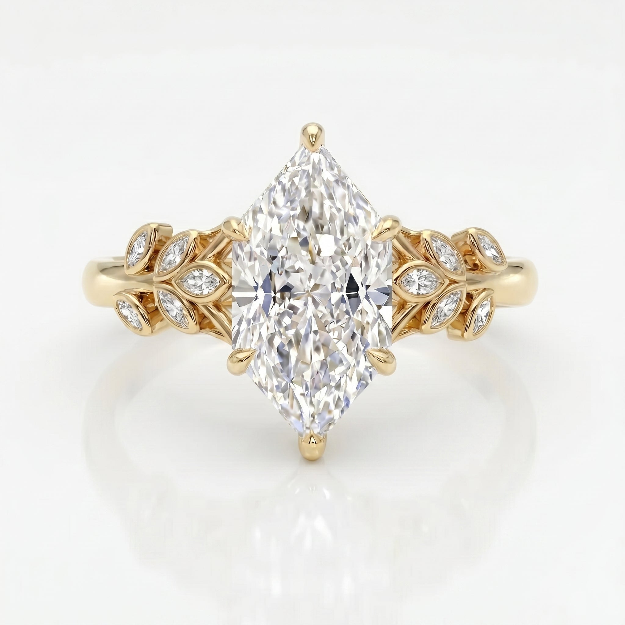 Marquise diamond engagement ring in yellow gold with leaf-inspired diamond accents on a clean white background