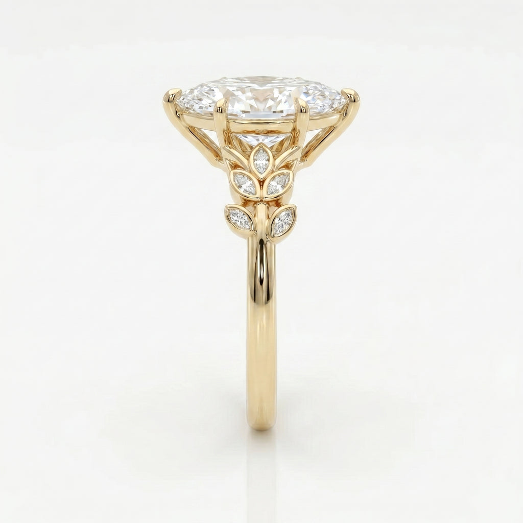 Side profile of marquise diamond engagement ring featuring elevated yellow gold setting and leaf accents