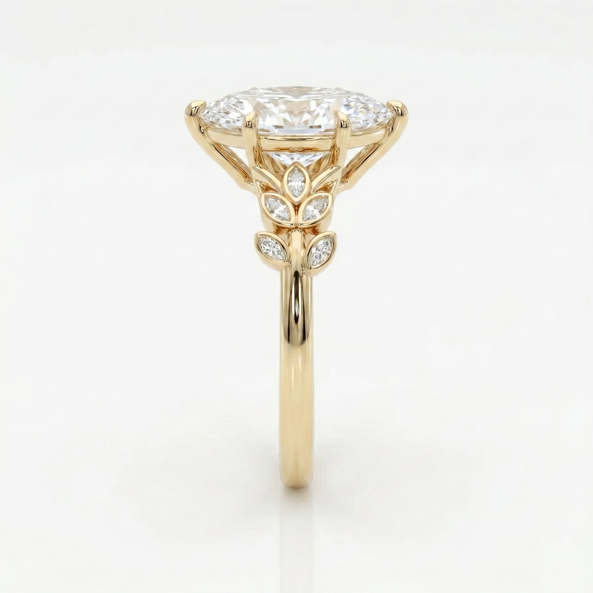 Side profile of marquise diamond engagement ring featuring elevated yellow gold setting and leaf accents