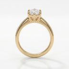 Front view of marquise cut diamond ring featuring baguette diamond accents in polished yellow gold