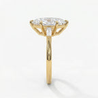 Side profile of marquise diamond engagement ring highlighting elevated basket setting and gold craftsmanship