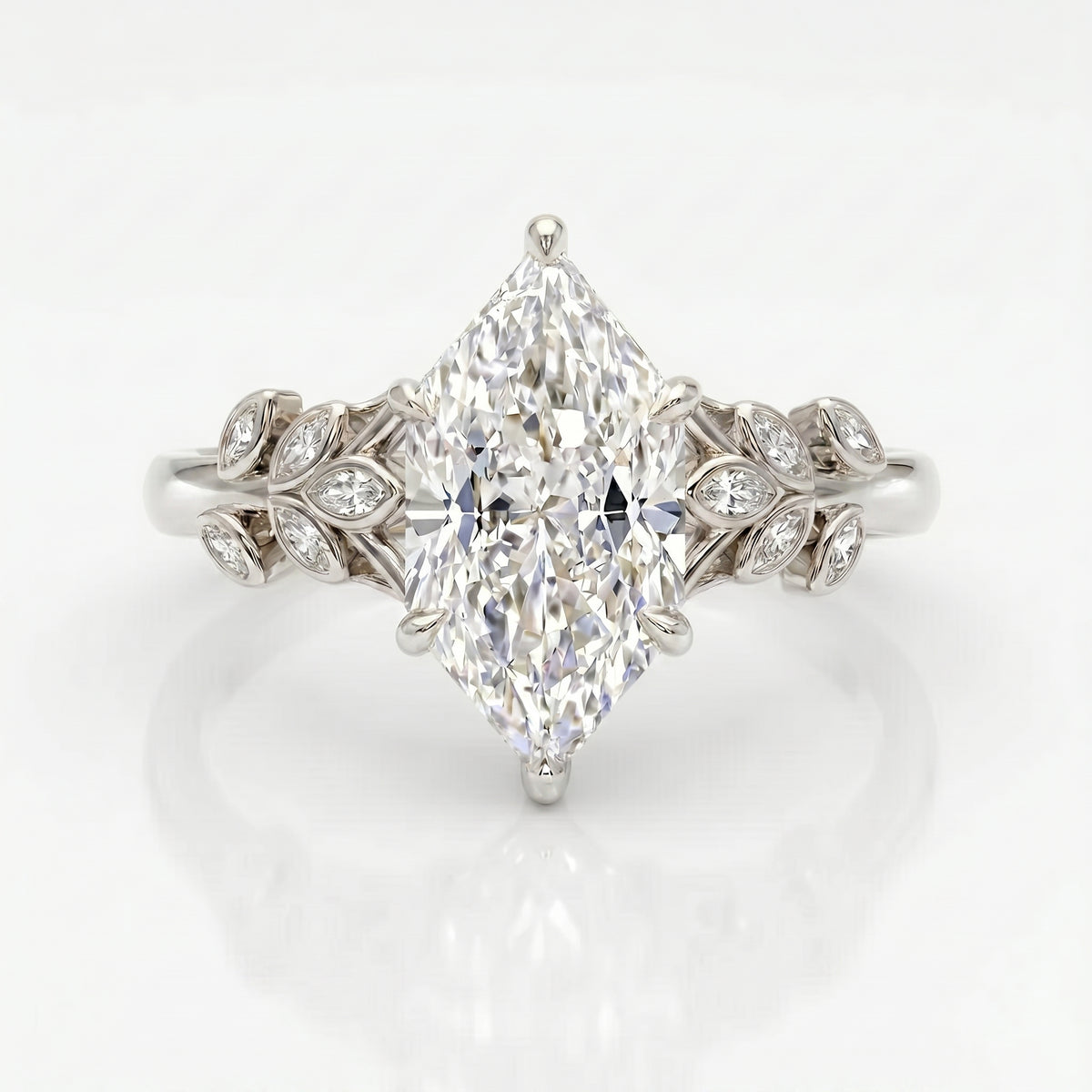 Top view of marquise diamond ring featuring intricate leaf shaped diamond accents and elegant band design
